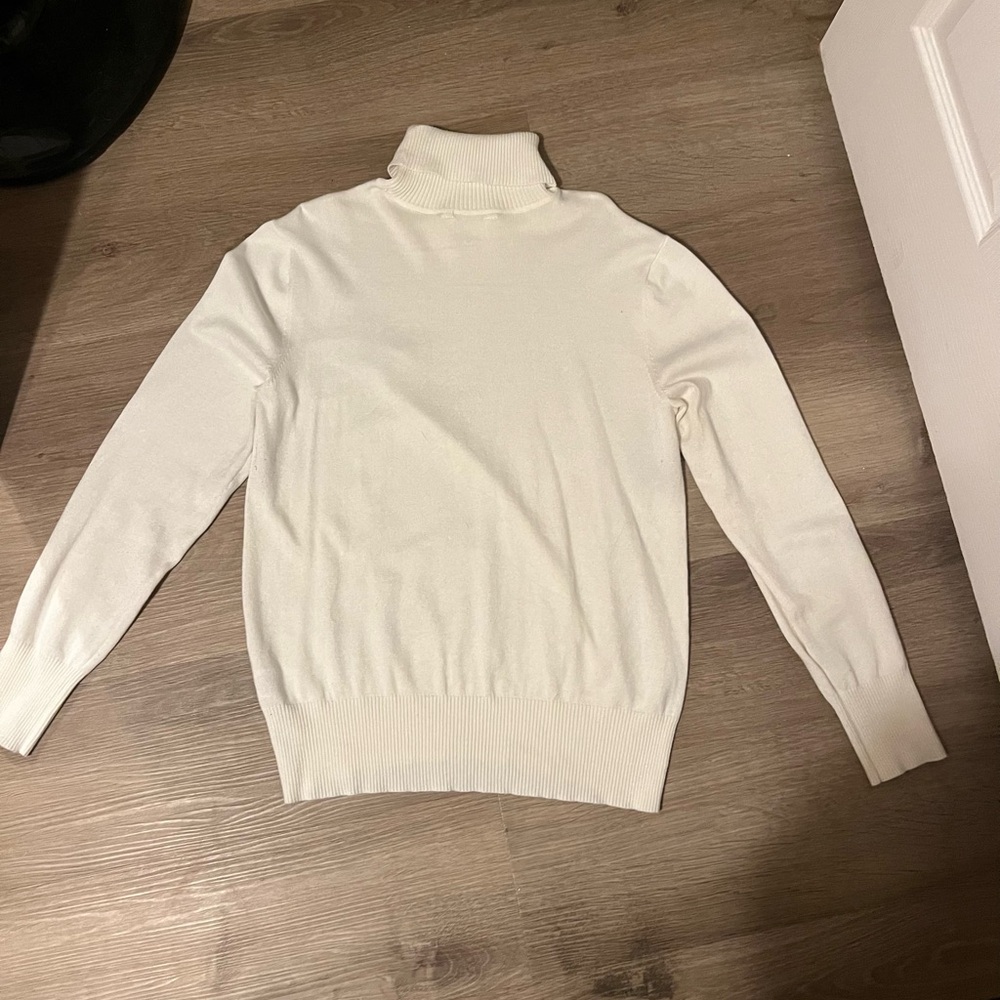 Basic white turtleneck sweater, light and breathable fabric, no tears or stains